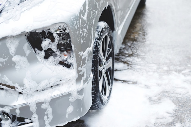 Outdoor car wash with foam soap.