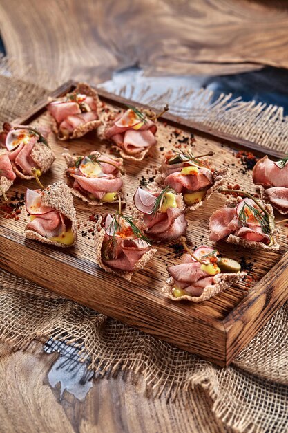 Outdoor catering banquet in summer. Table with snacks and canapes at a summer banquet.