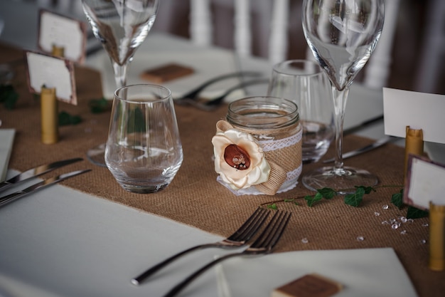 Outdoor catering dinner at the wedding with homemade garnishes decoration