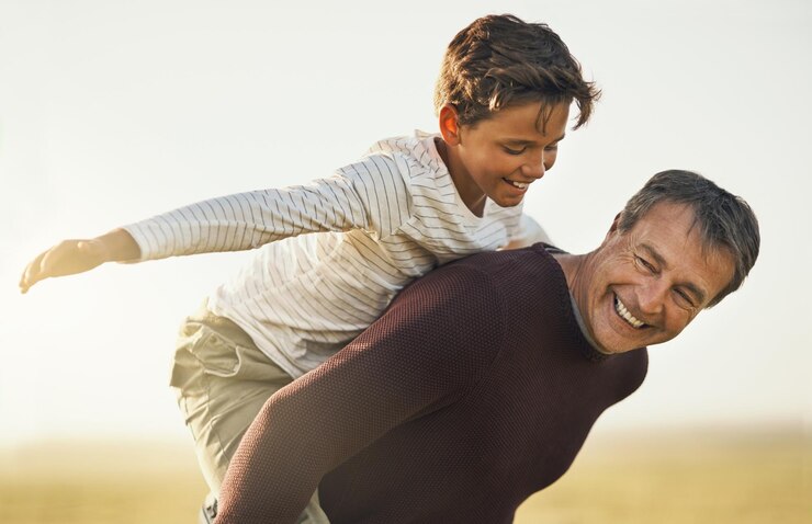 Photo outdoor father and airplane of son in nature love and smile for family together sunshine and playing countryside dad and visit of texas with boy for fresh air and bonding with child or piggyback