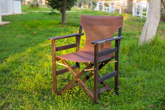 Outdoor furniture. Chair in hotel garden invite you to relax.