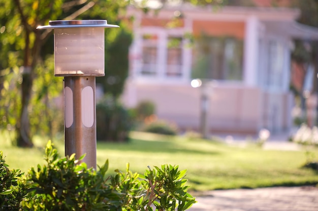 Outdoor lamp on yard lawn for garden lighting in summer park