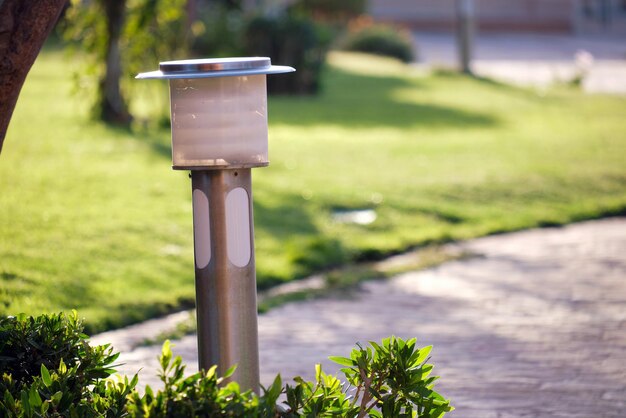 Outdoor lamp on yard lawn for garden lighting in summer park