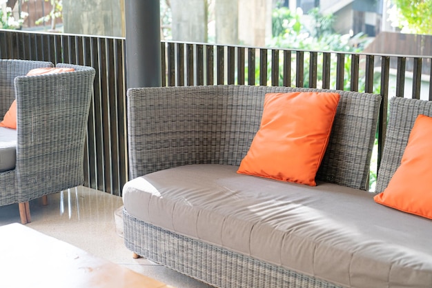 Outdoor patio chair with pillow on balcony