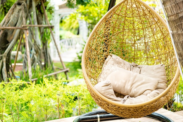 Outdoor patio with wicker swing chair