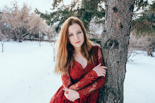 Outdoor photo of romantic lady in red dress