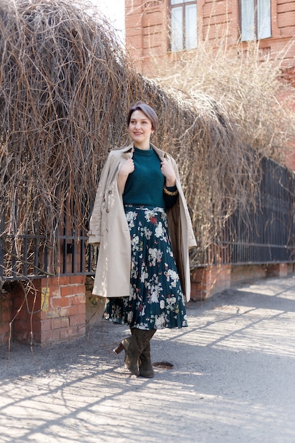 Outdoor portrait of an attractive stylish short cut woman