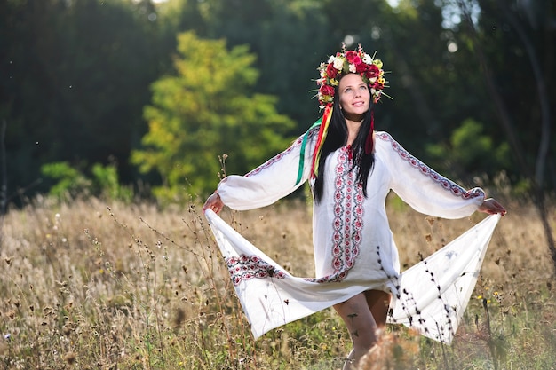 Outdoor portrait of beautiful pregnant Slav woman.