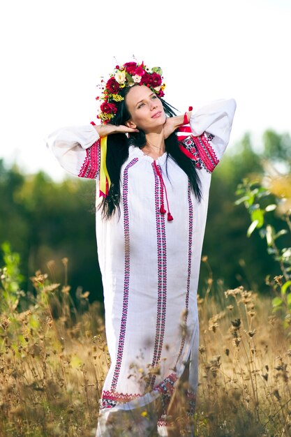 Outdoor portrait of beautiful pregnant Slav woman.