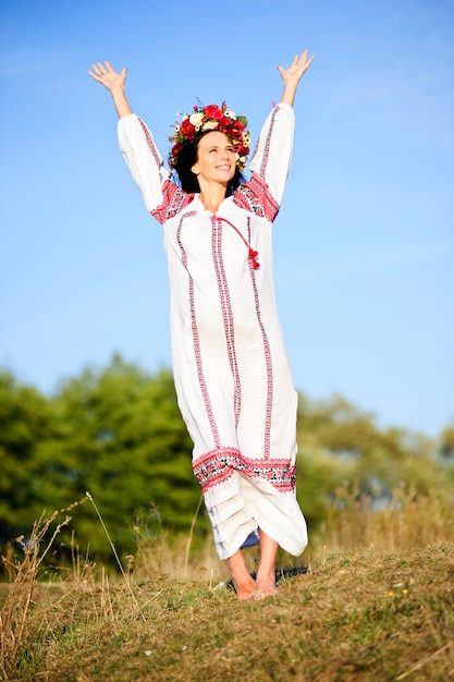 Outdoor portrait of beautiful pregnant Slav woman.