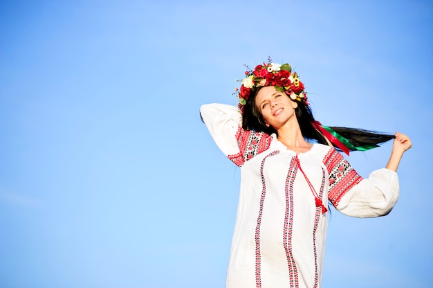 Outdoor portrait of beautiful pregnant Slav woman.