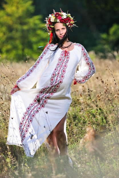 Outdoor portrait of beautiful pregnant Ukrainian woman