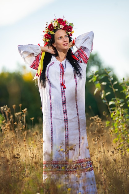 Outdoor portrait of beautiful pregnant Ukrainian woman