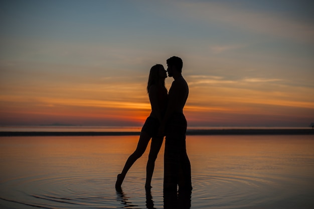 Outdoor portrait of beautiful traveling couple