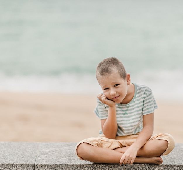 Outdoor portrait of a little cute boy