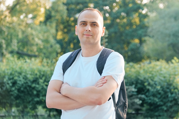 Outdoor portrait of mature smiling positive man. 