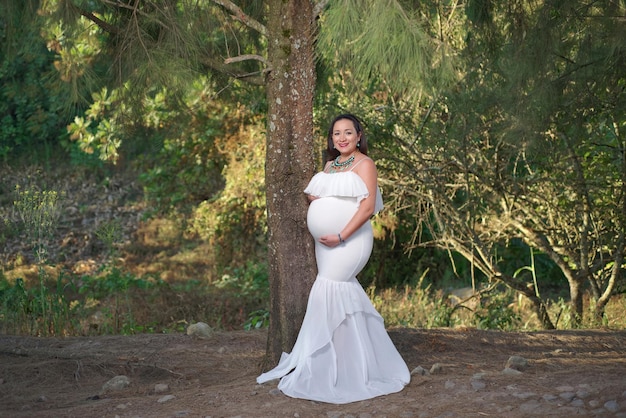 Outdoor portrait of pregnant young woman