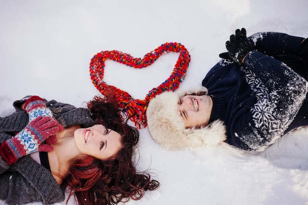 Outdoor portrait of young sensual couple in cold winter weather