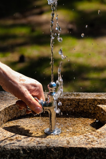 Outdoor public drinking fountain with water flowing