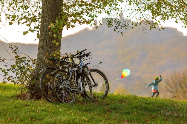 outdoor recreation on bicycles flying a kite