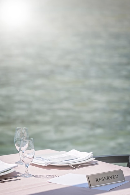 Outdoor restaurant table by the sea