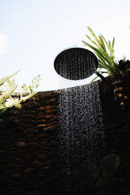 Outdoor shower that surrounded by wall