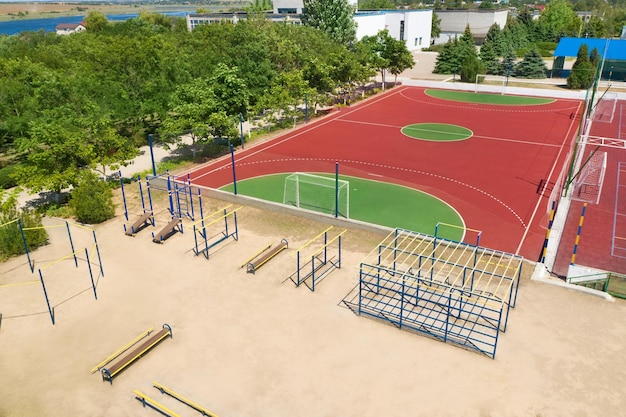 Outdoor sport equipment near football pitch on sunny day aerial view