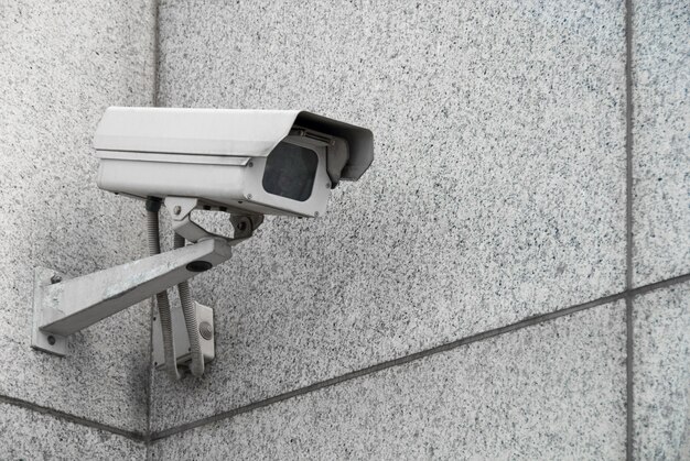 Outdoor surveillance camera on the facade of the building