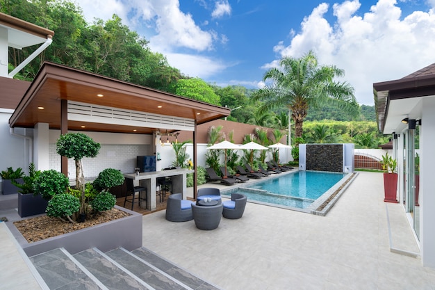 Outdoor swimming pool with counter bar in pool terrace