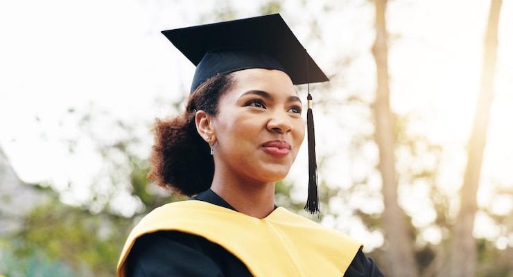 Photo outdoor woman and happy for graduation at university with pride and confidence for future in cuba female person college learner and smile for qualification education and achievement on campus