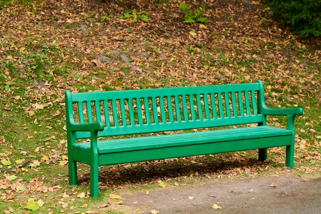 Outdoor wooden seat for relaxing painted seat in the park outdoors on a sunny day