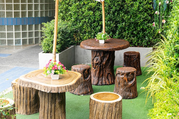 Outdoor wooden table and chair in garden