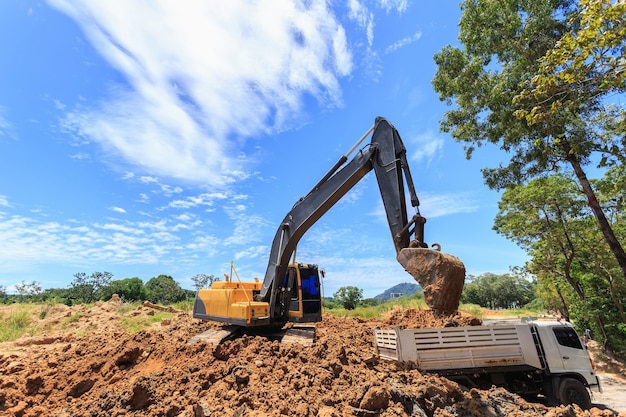outdoor work: excavator digging to moving the soil