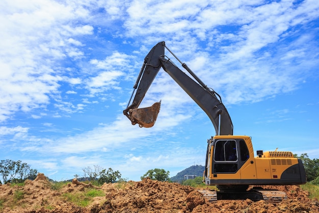 Outdoor work: Excavator digging to moving the soil