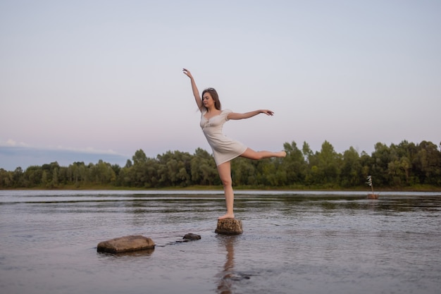 Outdoors fashion photo of beautiful bohemian lady at river