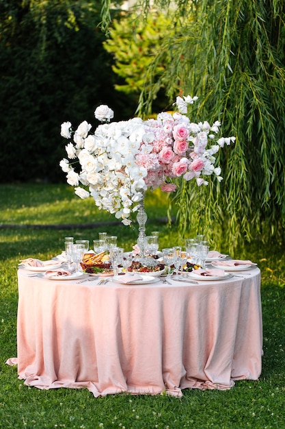 Outdoors nature banquet table set with candles