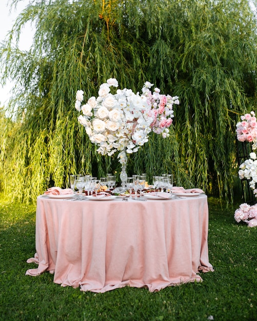 Outdoors nature banquet table set with candles