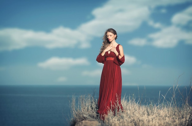 Outdoors portrait of a pensive woman in medieval dress