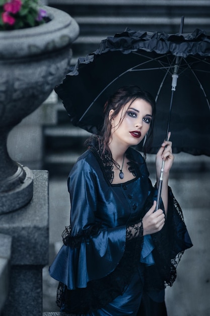 Outdoors portrait of a victorian lady in blue