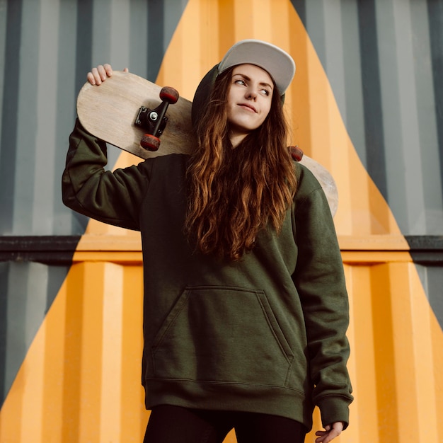 outdoors skater girl and her skateboard