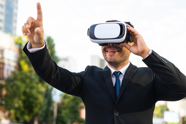 Photo outdoors successful business person using virtual reality set