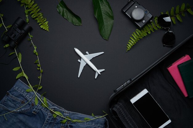 Photo outfit and accessories of traveler on black background  . summer travel concept .