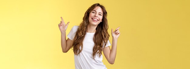 Outgoing cheerful attractive woman curly haircut wear casual white t-shirt dancing party having fun