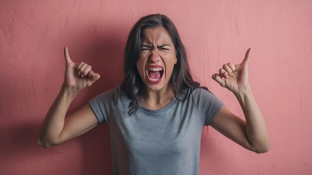 Outraged woman yells from rage gestures angrily looses temper being annoyed with something hate