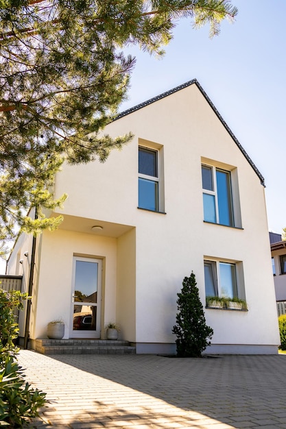 Outside view of a simple white private contemporary house