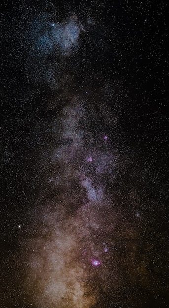 The outstanding beauty and clarity of the Milky Way, with details of its colorful core. Vertical panorama of 6 stitched photos. Telephoto captured high up from the Alps. 