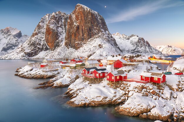 Outstanding sunset winter view on hamnoy village and festhaeltinden mountain on background popular tourist destination on lofotens location hamnoy moskenesoya lofoten norway europe