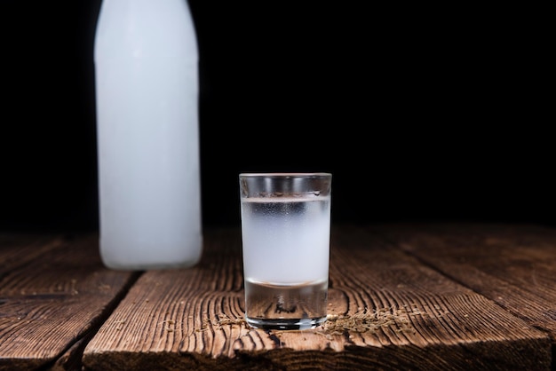 Ouzo on wooden background