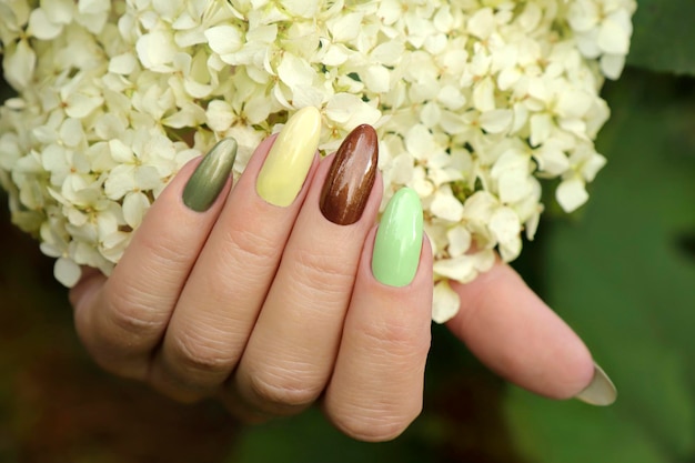 Oval multicolored manicure with hydrangea