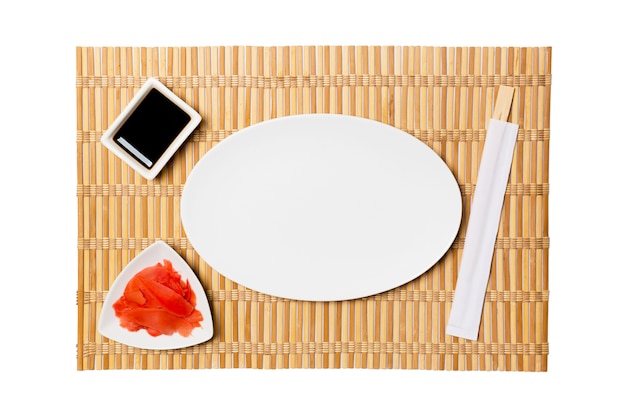 Oval white plate with chopsticks for sushi